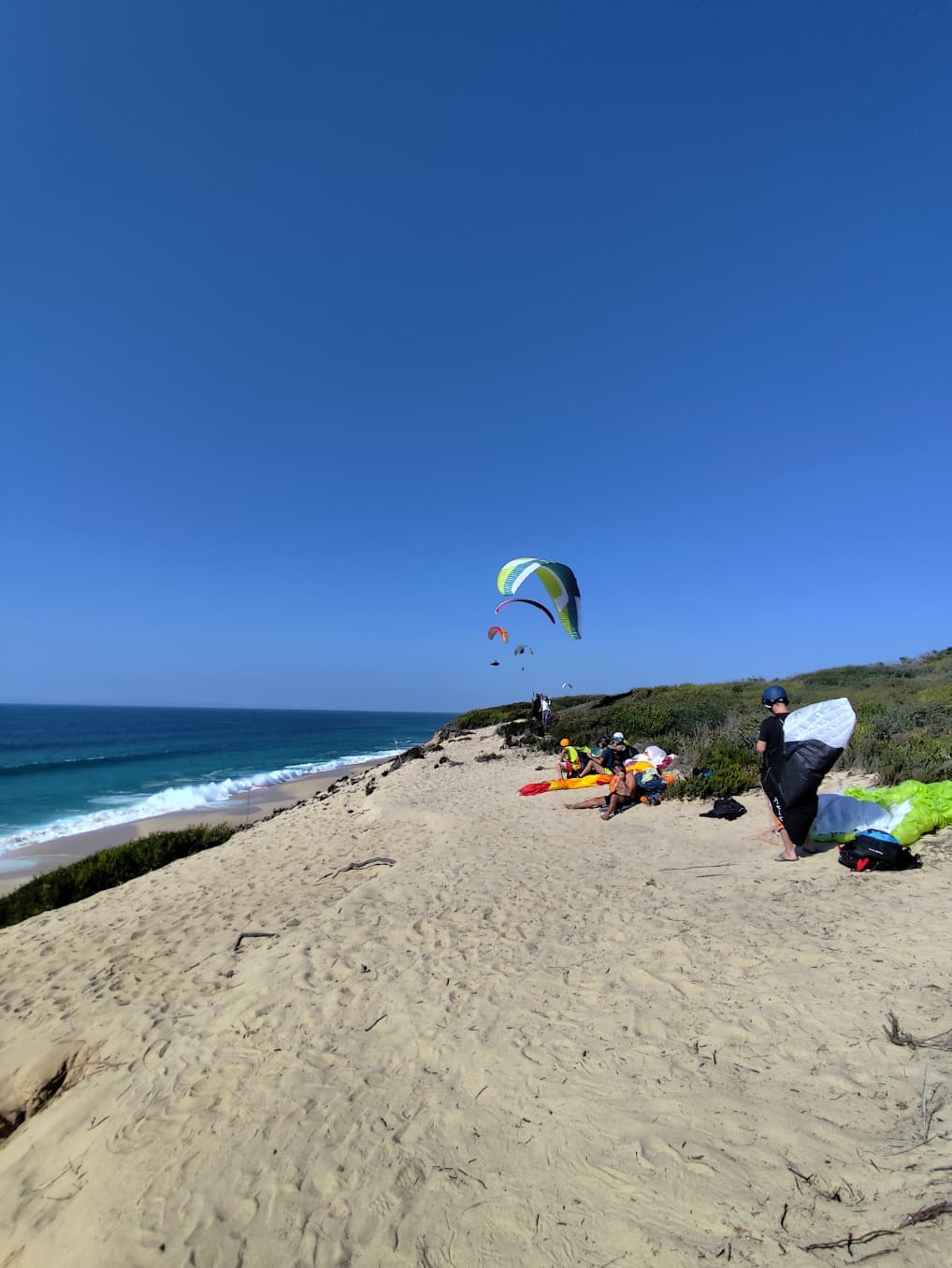 Pilots launching at Alberta Nova on the Atlantic dunes